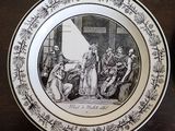 a plate with a picture of a man and a woman on it