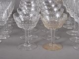 a lot of wine glasses that are sitting on a table
