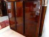 an image of a large wooden cabinet in a room