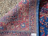 a close up of a rug on the floor with a rug on top of it