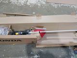 a cardboard box with tools inside of it on the floor