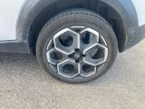 a close up of a car ' s tire on the street