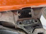 a close up of a motorcycle with a number plate on it