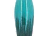 a blue vase that is sitting on a table