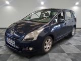 a picture of a small blue car parked in a garage