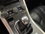 a close up of a car ' s interior with a gear stick
