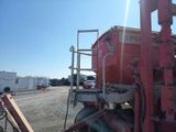 a red truck that is parked on the side of the road