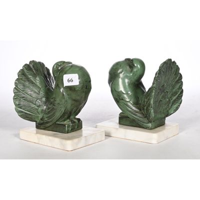 pair of green bird bookends on marble bases