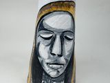 painting of a woman ' s face on a vase on a white surface