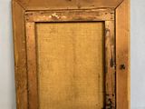 an old wooden picture frame with a burlock cloth backing
