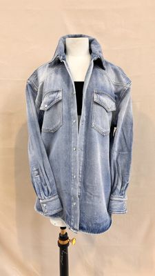 an image of a denim shirt on a mannequin stand
