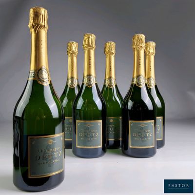 six bottles of champagne are lined up in a row