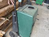 several pieces of wood are stacked on a cart in a garage