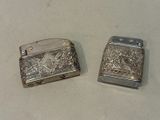 two lighters that are sitting on a table