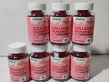 six bottles of collager gummies sitting on a table