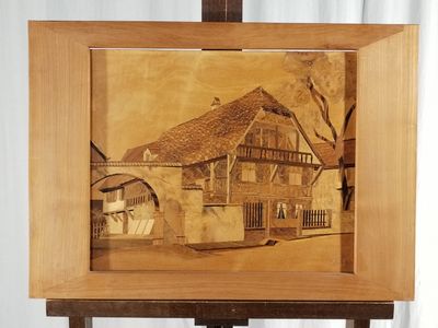 a picture of a picture of a house on a easel