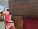 a red chair that is sitting in the middle of a room