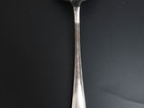 a spoon that is sitting on a black table