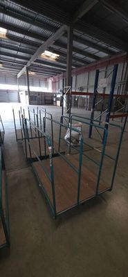 a large warehouse with a lot of shelves and pallets on the floor
