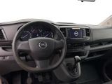 a dashboard of a car with a steering wheel and a dash light