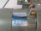 a motor that is sitting on a white surface
