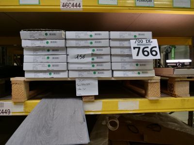 a large stack of boxes on a pallet in a store