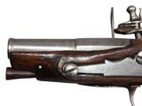 a close up of a gun with a man on it