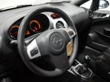 the interior of a car with a steering wheel and dashboard controls