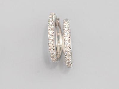 a pair of diamond hoop earrings