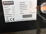 a close up of a black oven with a label on it