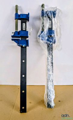a blue pipe clamp and a blue pipe clamp on a table