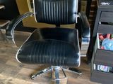 an image of a black office chair in a room