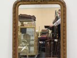 a mirror that is sitting on the floor in a room