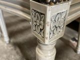 a close up of a bench with a bunch of beads on it