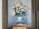 a picture of a vase of flowers on a table next to a picture of a horse drawn carriage