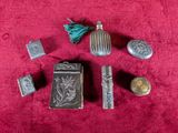 a lot of silver objects on a red cloth