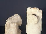 two vases that are sitting on a table