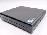 a close up of a black dvd player sitting on a white surface