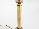 an image of a brass table lamp on a white background