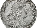 a silver coin with a woman ' s head on it