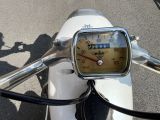 a close up of a motorcycle with a speedometer on it ' s handlebar