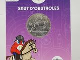 an image of a book with a picture of a person on a horse jumping over a hurdle