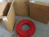 several boxes and a hose on the floor next to each other