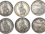 six types différents de pièces d'argent sur fond blanc