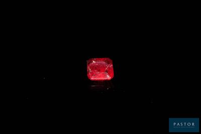 a red diamond on a black background