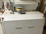 a machine that is sitting on the floor in a room
