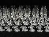 a lot of empty wine glasses on a black table