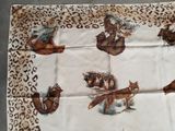 a table cloth with a picture of animals on it