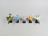 un ensemble de quatre petites figurines de formes et de tailles différentes
