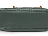 a green purse on a white background